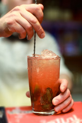 Woman Barman Making Strawberry Mahito Cocktail