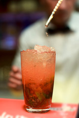 Woman Barman Making Strawberry Mahito Cocktail