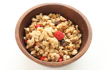 Healthy breakfast, granola in wooden bowlHealthy breakfast, granola in wooden bowl