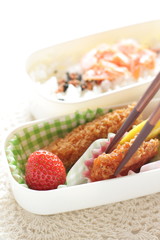Japanese bento packs lunch, salmon and rice with cutlet