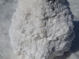salt block, a huge block of salt on which structured grains of salt are visible