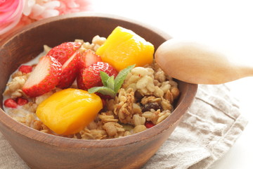 Healthy breakfast, granola mango and strawberry cereal and milk
