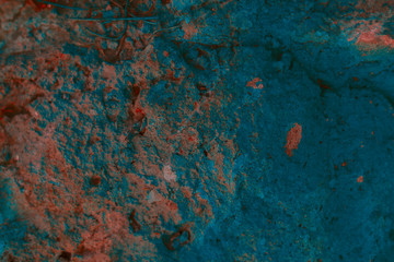 Background texture natural colored stone. Concrete wall of green, red, blue, Aqua color