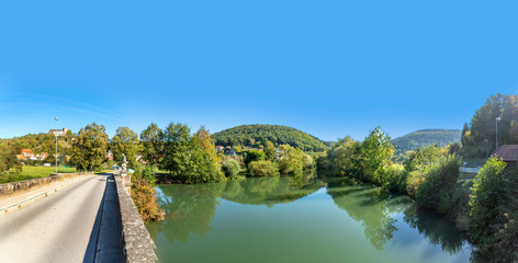 ols roman god Nepomuk at the old bridge spanning river Lahn in Limburg an der Lahn,