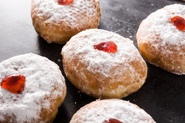 Hanukkah sufganiyot. Traditional Jewish donuts for Hanukkah.