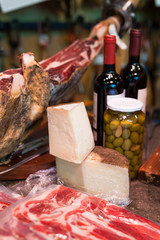 jerked iberic jammon of bacon with wine, cheese and olives