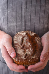 Baker and his rye flour bread