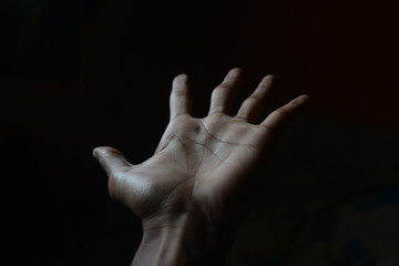 Fototapeta premium human palm with black background