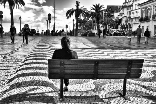 Street photography in black and white at  Main Square of Cascais town, Portugal.