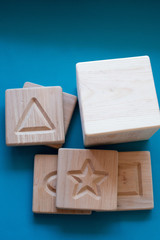 wooden squares with geometric shapes