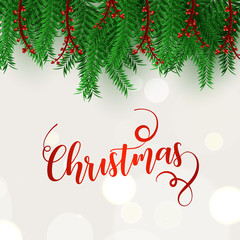 Stylish calligraphy of Christmas on bokeh background decorated with green pine leaves and holly berries. Can be used as greeting card design.