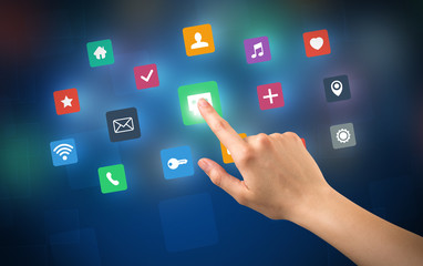 Female hand touching colorful applications
