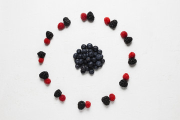 Delicious circle of wild berries and strawberries