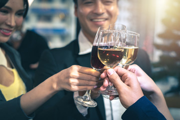 Successful business celebration - group of business people clinking  glasses at the party.