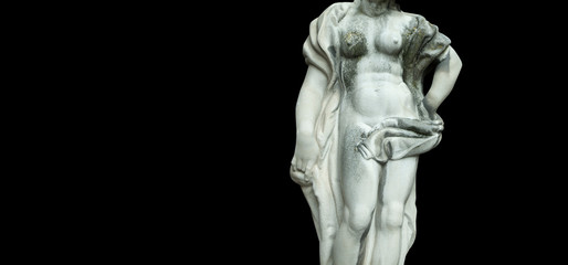 Fototapeta na wymiar The goddess of love Aphrodite (Venus). Fragment of ancient statue isolated on black background.