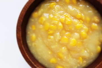 prepared cream sweet corn in wooden bowl