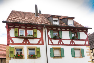 Fototapeta premium white red half timbered houses with shutters and flowers, Eppingen, Germany