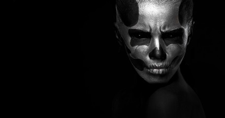 Fototapeta na wymiar Halloween. Woman in day of the dead mask skull face art. Halloween face art on black background. Halloween make up.