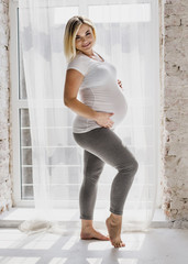 Pregnant woman looking at camera