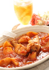 Chicken drumsticks and potato simmered 