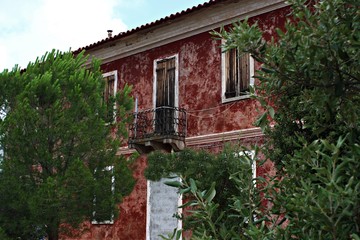 Italy, Sardinia: Red ancient house.