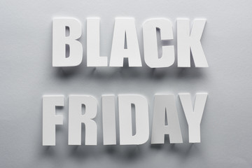 top view of black Friday lettering on grey background