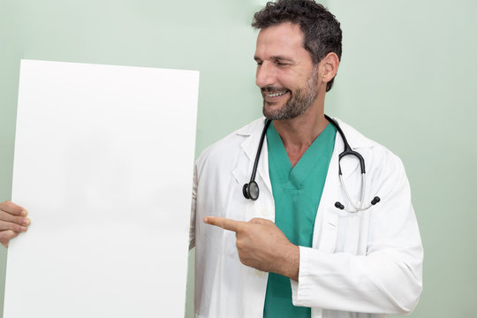 Attractive doctor smiling, wearing uniform and stethoscope showing a blank sign to copy space. on the poster you can put medical recommendations, as well as photographs of healthy foods and other reas