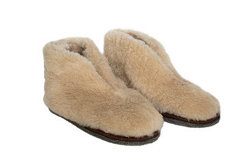 sheep wool white slippers close up photo isolated on white background. handmade short Felt boots valenki