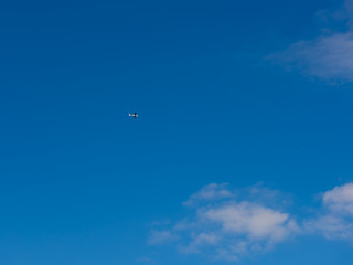 Fototapeta na wymiar Small plane in the blue sky.