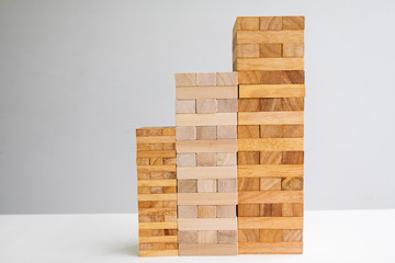 Wood block tower with architecture model, Planning Alternative Risk and Strategy in Business concept