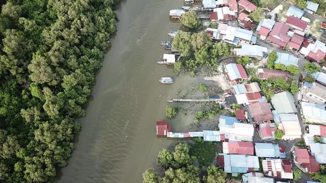 Top view fishing village surrounded by mangrove trees at Kuala Juru, Penang.