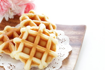 Waffle on wooden plate for gourmet dessert