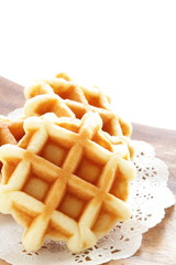 Waffle on wooden plate for gourmet dessert