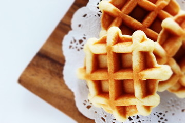 Waffle on wooden plate for gourmet dessert