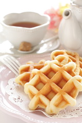 Waffle on wooden plate for gourmet dessert