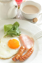 Homemade sausage and sunny side up fried egg with ham