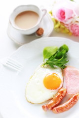 Homemade sausage and sunny side up fried egg with ham