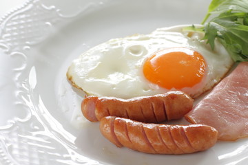 Homemade sausage and sunny side up fried egg with ham