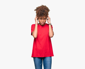 Beautiful young african american woman over isolated background with hand on head for pain in head because stress. Suffering migraine.