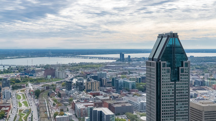 Fototapeta na wymiar Montreal in Canada, aerial view with the tallest skyscraper and the Saint-Laurent river