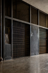 Old industrial faciliities interior hall with lifts metallic doors