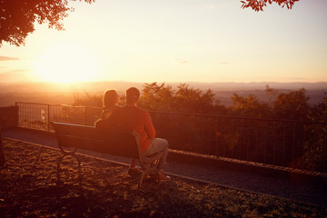 Fototapeta premium romantic couple at sunset. couple is enjoying sunset in the city. .