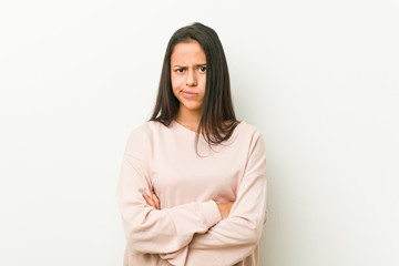 Young cute hispanic teenager woman unhappy looking in camera with sarcastic expression.