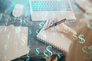 Financial graph displayed on woman's hand taking notes background. Concept of research. Multi...