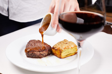 steak on plate with fork and knife