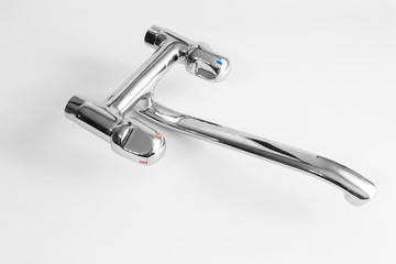 Water mixer. water tap made of chrome material on white background