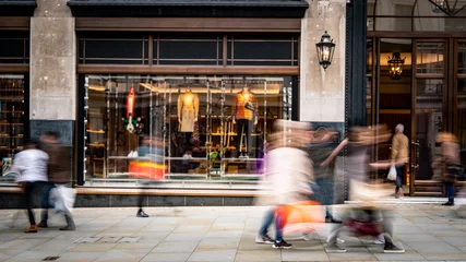 Deurstickers Motion blurred people walking on shopping street © William