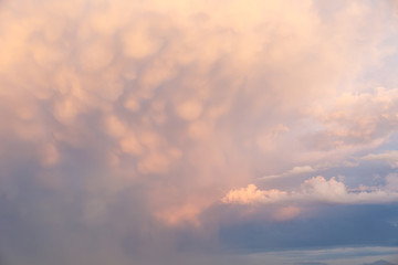 Big and thick clouds on the horizon. Blue sky with thick clouds. Soft focus