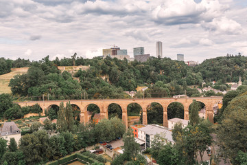 Obraz premium Luxembourg modern city and old arch railway bridge