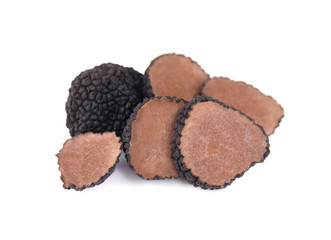 Black truffles isolated on a white background. Fresh sliced truffle. Delicacy exclusive truffle mushroom. Piquant and fragrant French delicacy. Clipping path.